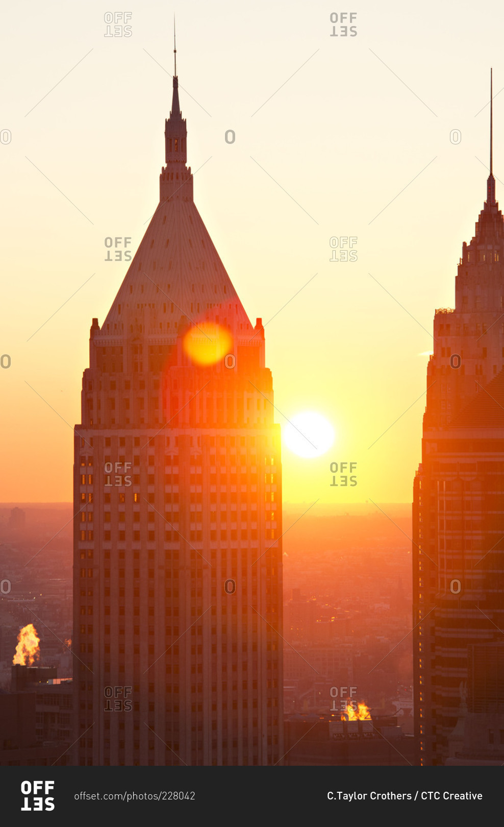 Sun setting between skyscrapers in Manhattan
