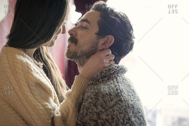 Couple in loving gaze in cafe