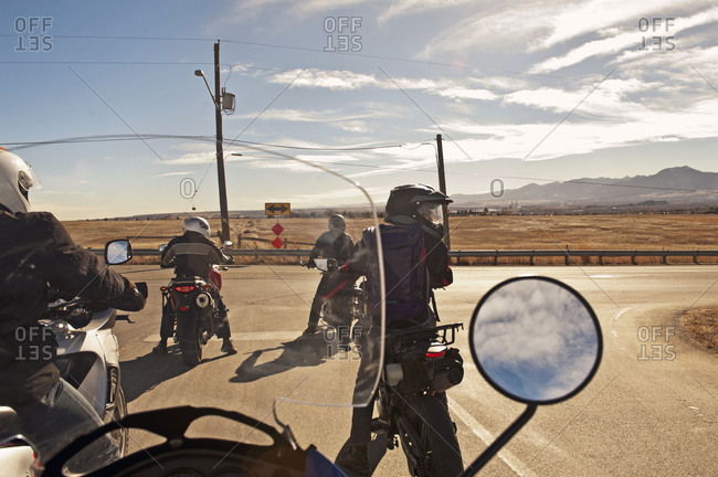 Bikers traveling out on open road
