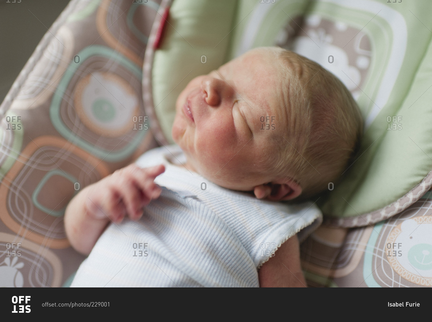 A newborn baby cranes his neck stock photo OFFSET
