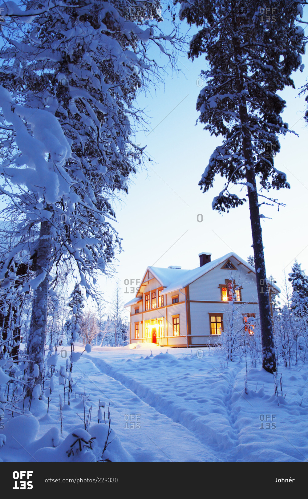 Illuminated house in winter
