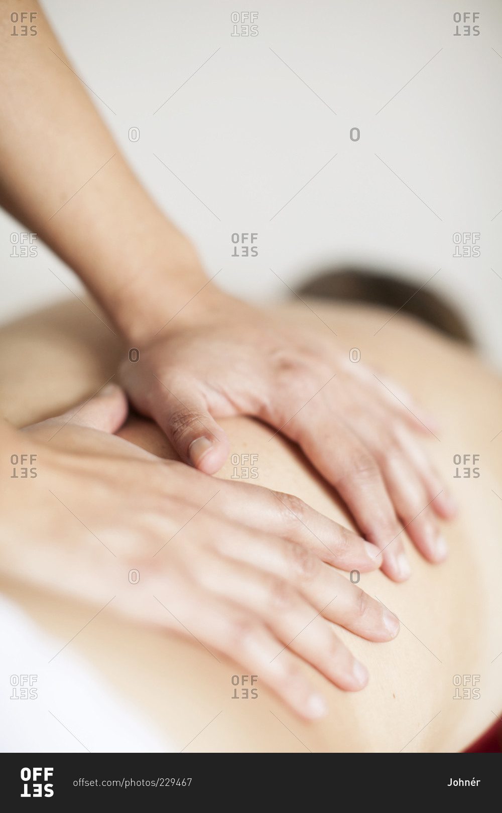 Hands giving a back massage