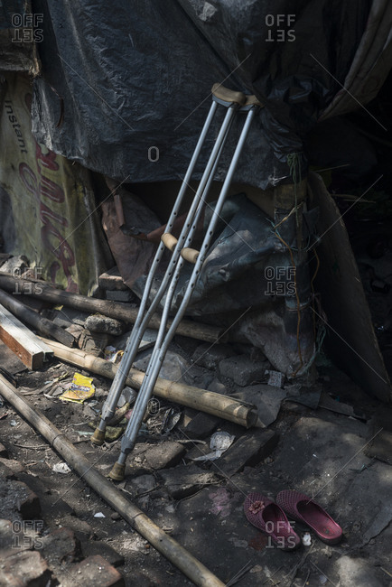 Crutches left by the side of a shack in the slums of Thapathali, Kathmandu, Nepal