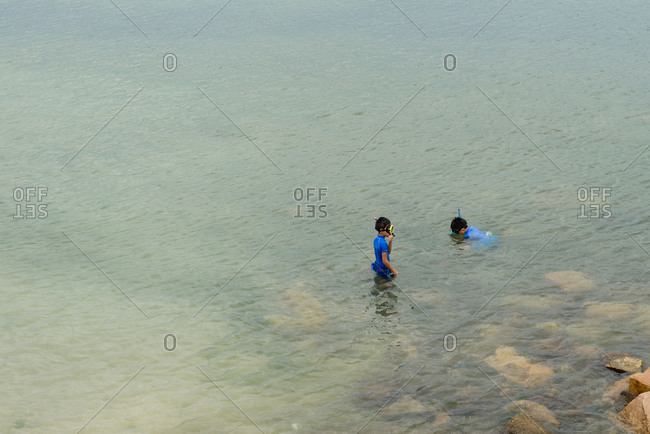 Osaka, Japan - August 15, 2014: Two boys snorkeling in Japan