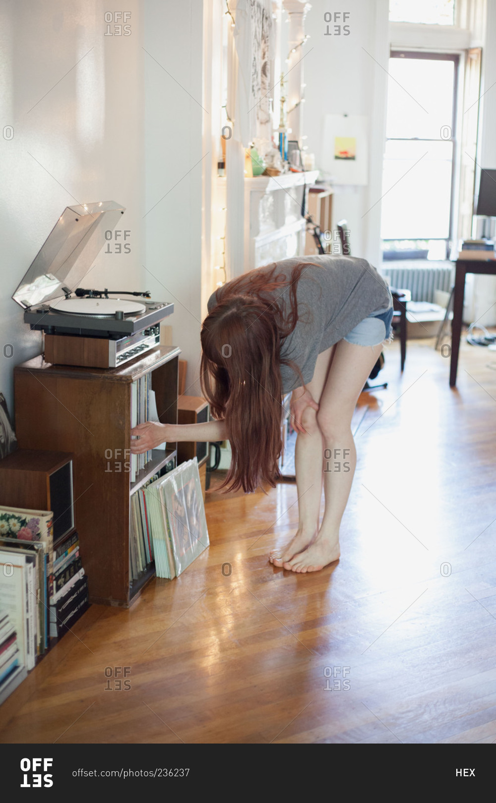 Woman choosing a record album from a shelf