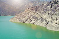 Mountain shoreline along still lake