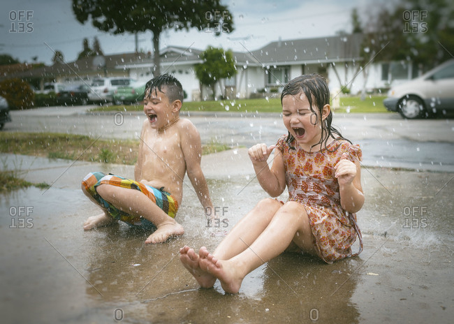 boy and girl in the rain