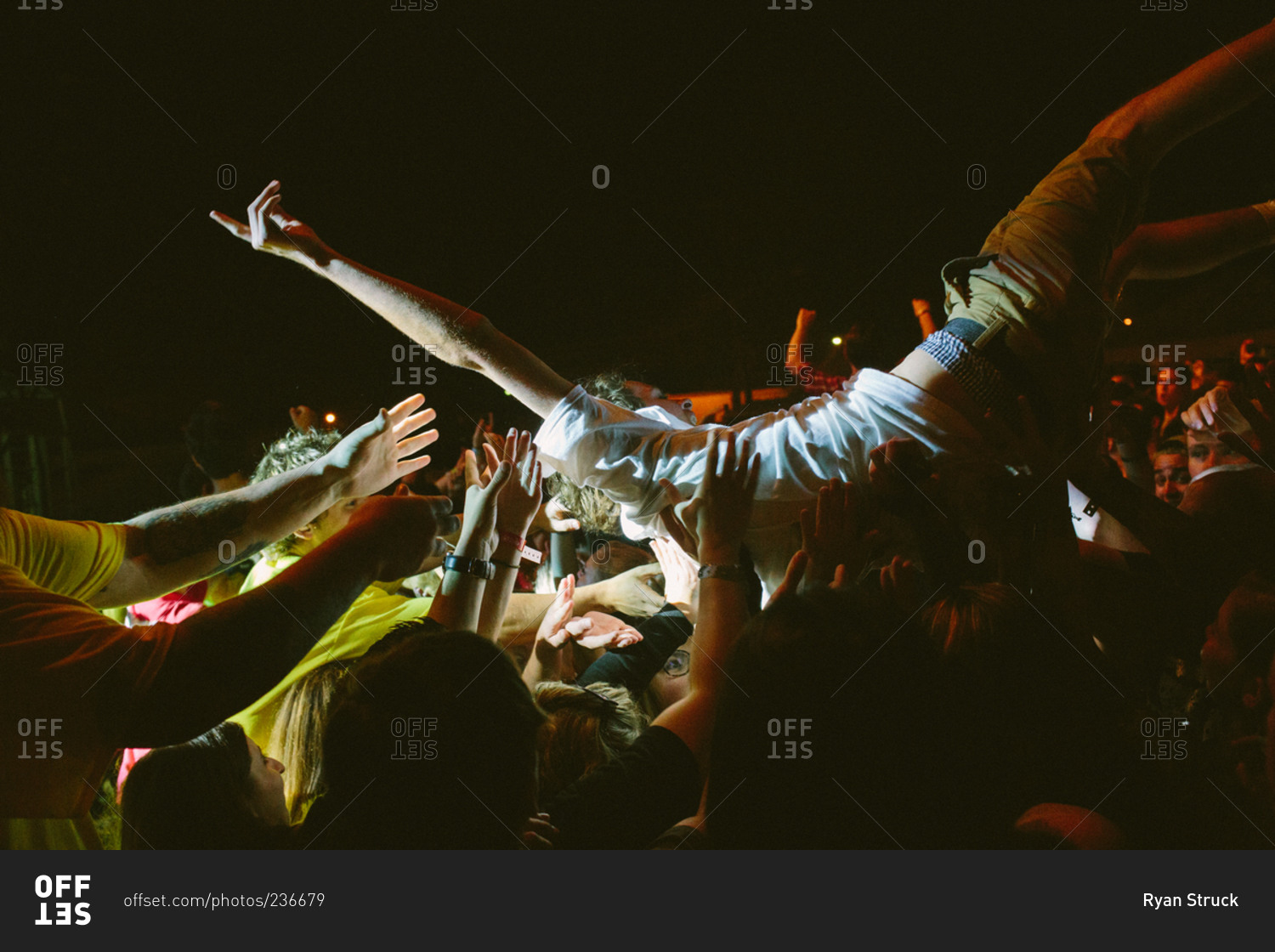 Crowd surfing at a rock concert