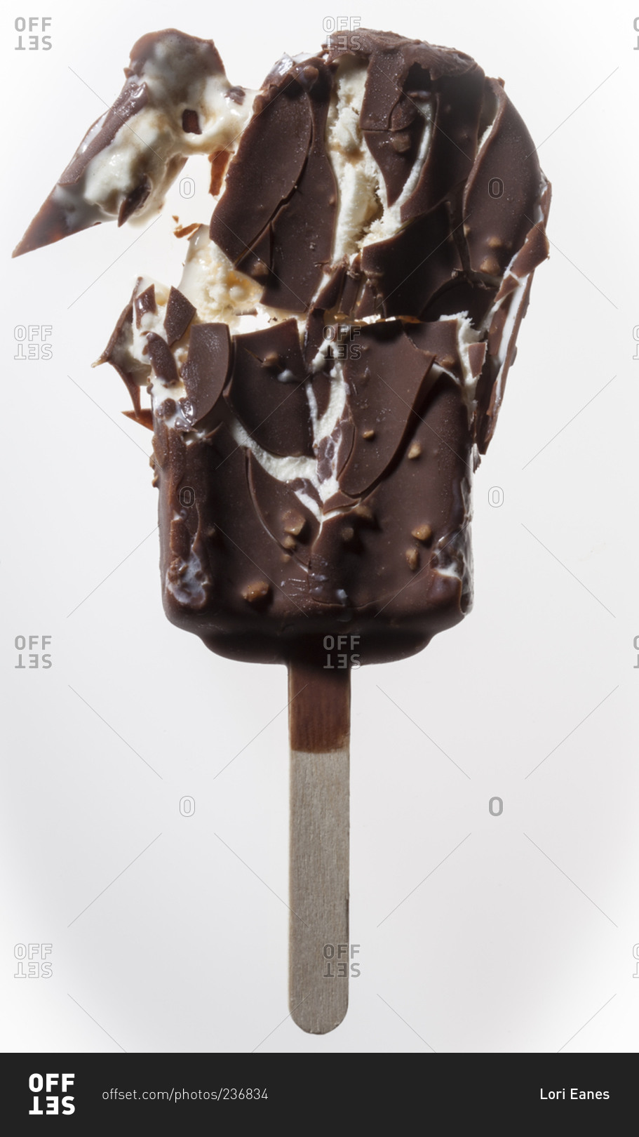 A smashed chocolate-covered ice cream bar