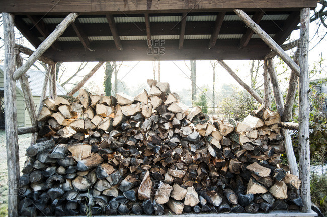 A pile of wood in a shed