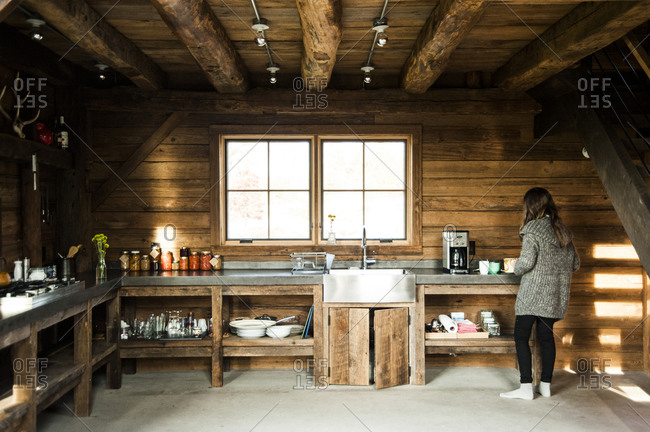 Accord, NY - October 31, 2011: A woman prepares coffee in a renovated barn