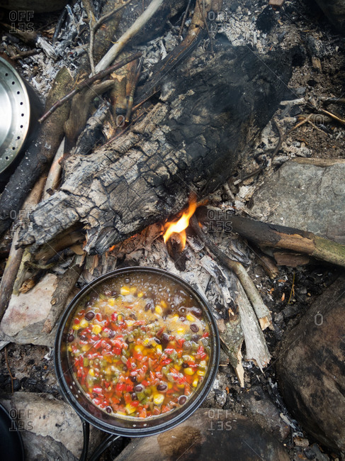 Pot of soup on a campfire