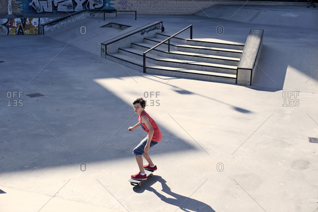 Pre-teen skateboarder at skate park