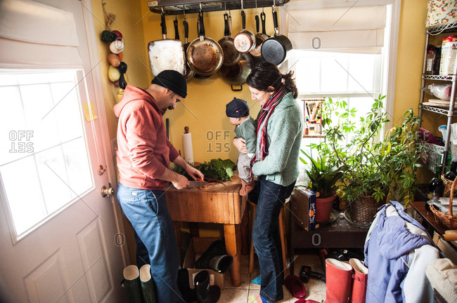 Holyoke, Massachusetts - February 11, 2013: Bates family preparing vegetables grown on their permaculture farm