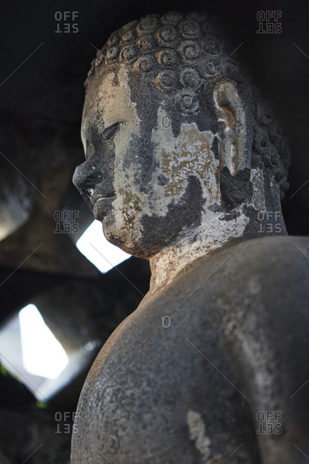 Buddha statue detail at Borobudur in Magelang, Central Java, Indonesia