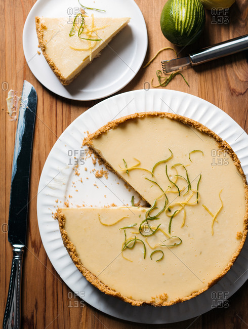 Key lime pie topped with slivers of lemon and lime rind