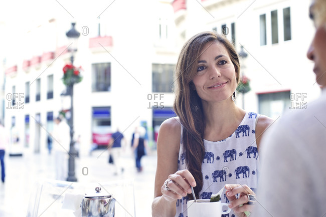 Woman having tea at an outdoor caf_