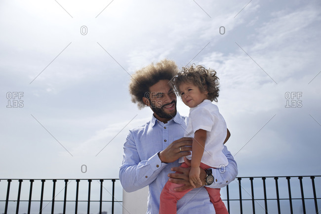 Man and his toddler son at a scenic overlook