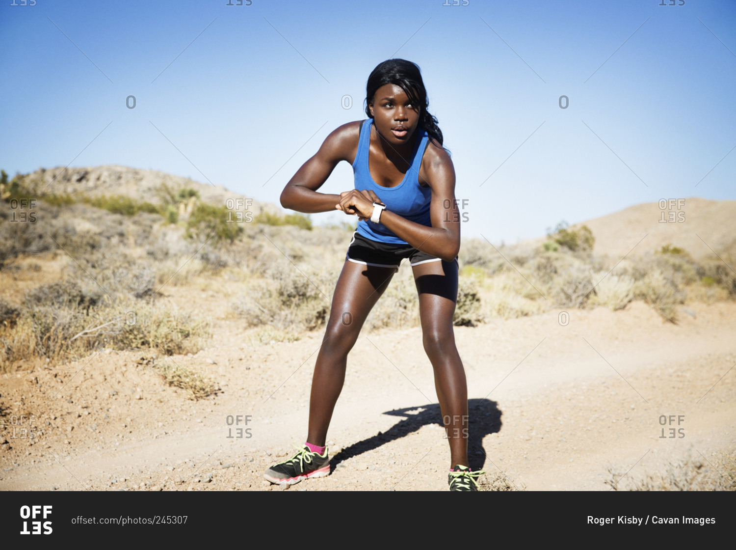 Athletic woman in remote setting ready for a run