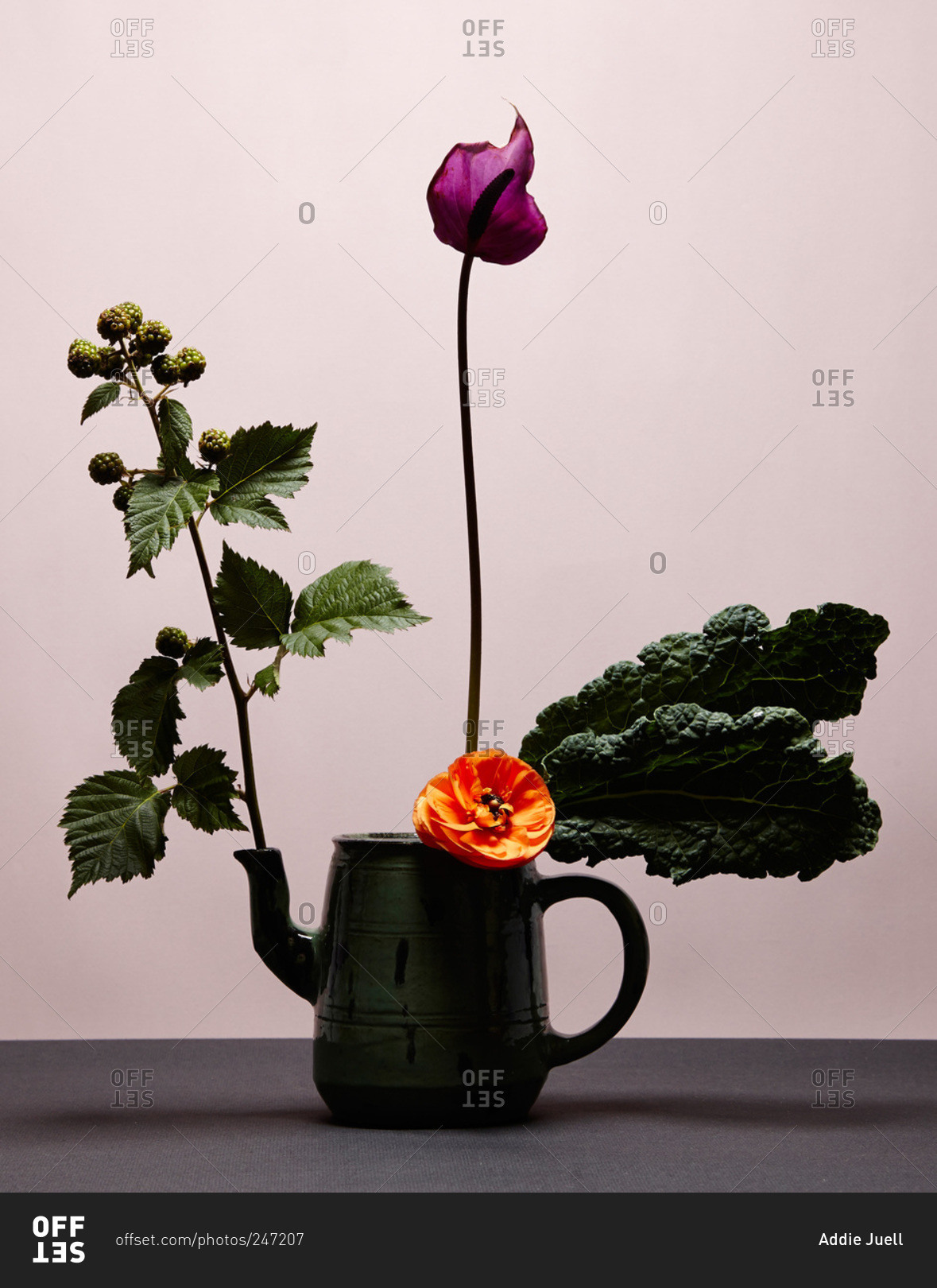 A lily and ranunculus flower arrangement