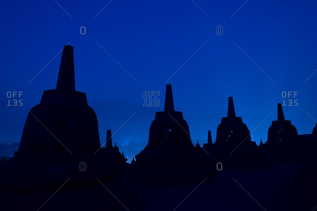 Stupas silhouetted at sunrise, Borobudur, Indonesia