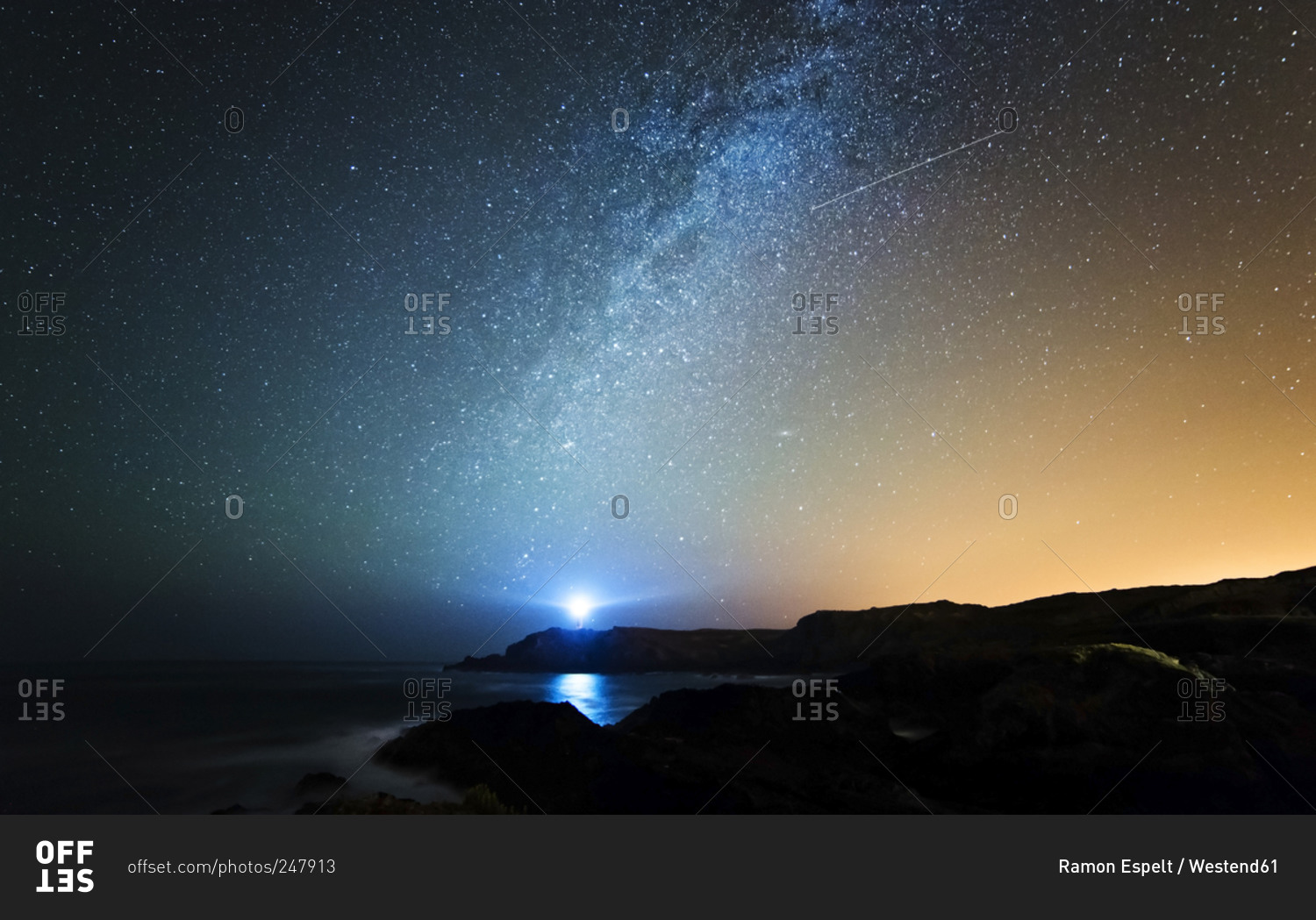Starry sky with milky way and shooting star above the Galician coast