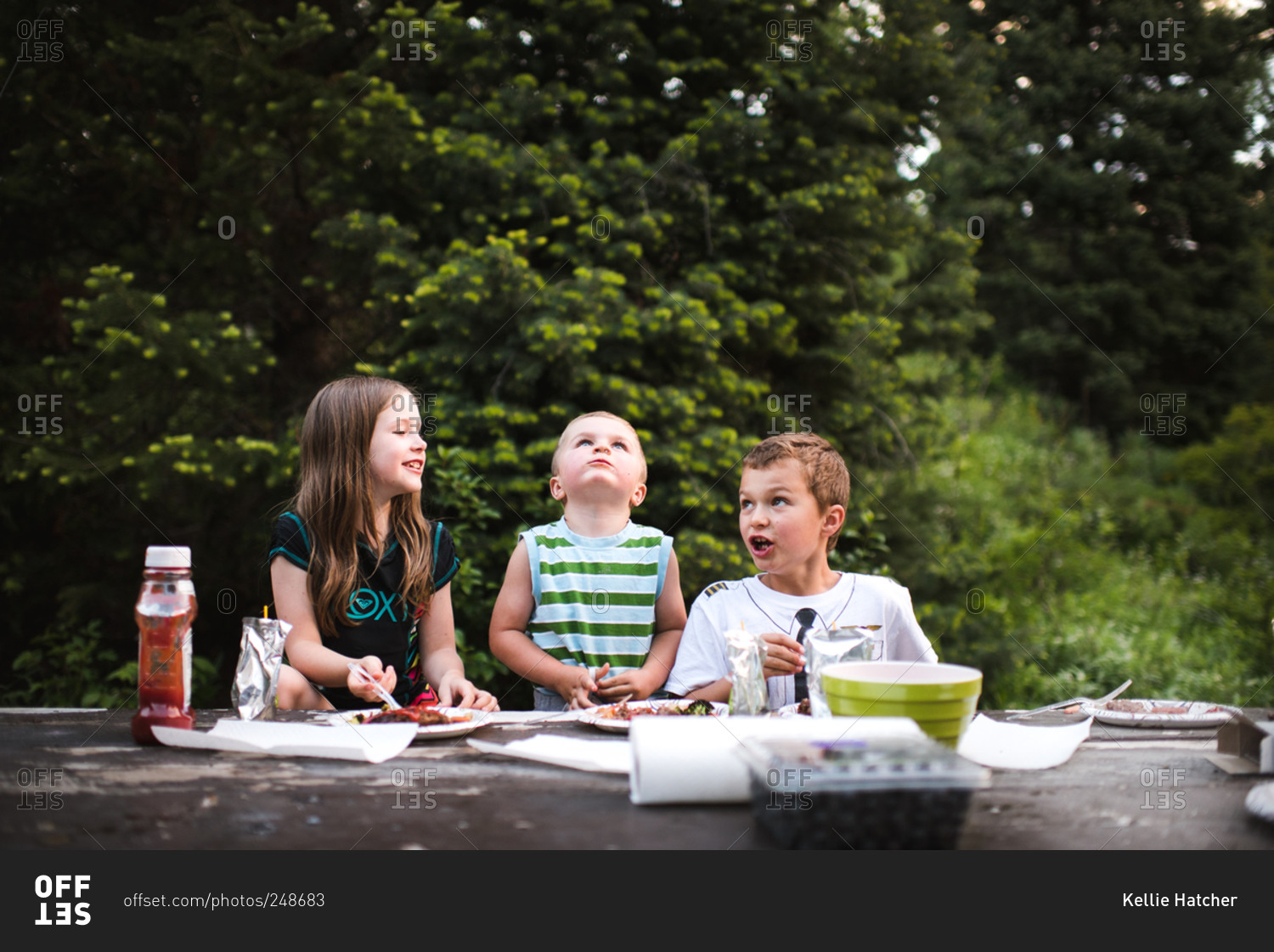 Children eating at a campground picnic table