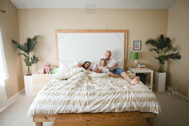 Family spending time in bed together