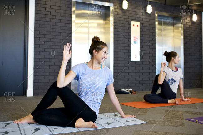 Women doing office yoga - Offset