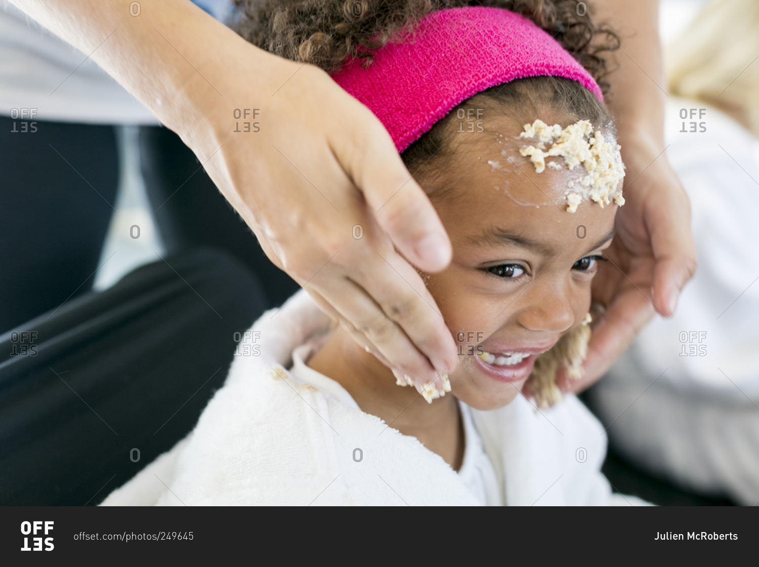 Santa Fe, New Mexico - June 24, 2015: Little girl getting\
oatmeal scrub at a spa party designed by Parties for Peanuts stock\
photo - OFFSET