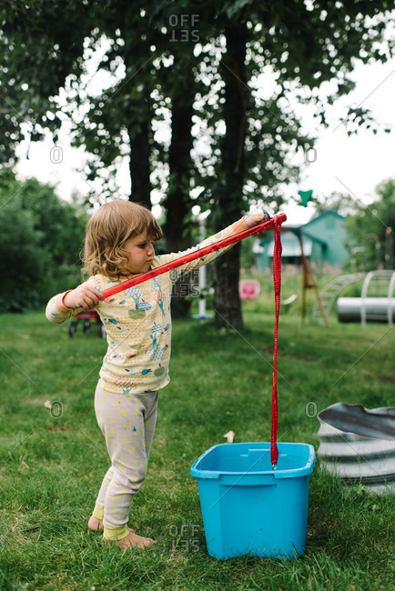 Little girl holding a bubble wand
