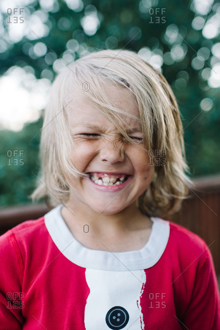 Portrait of boy grinning - Offset