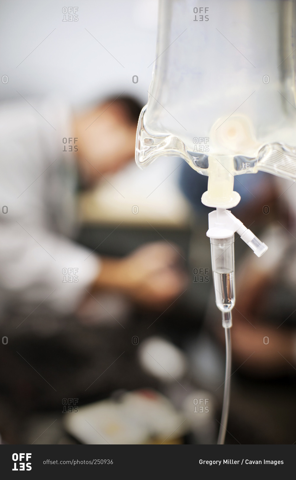 An IV bag hanging in a hospital room stock photo - OFFSET