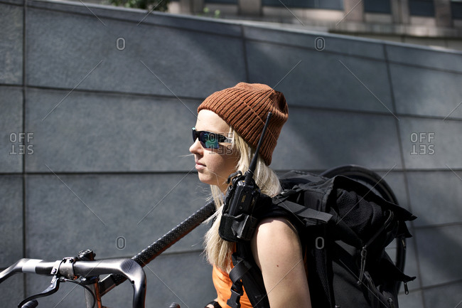 Woman carrying her bike