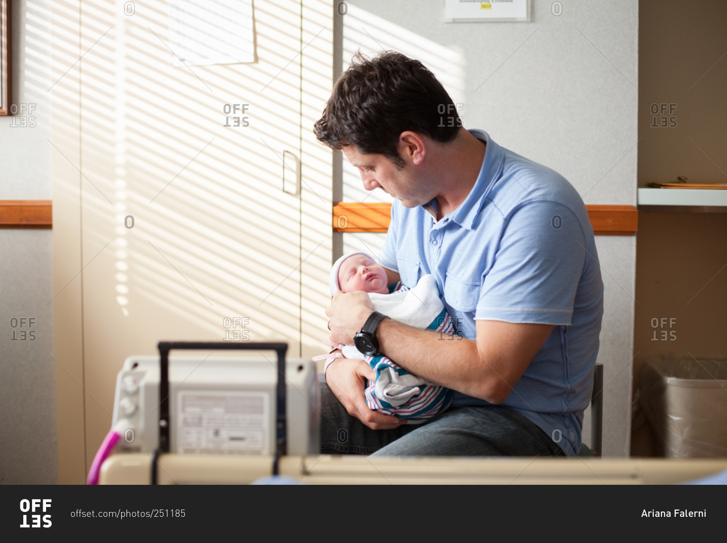 Image result for Father sitting to new born baby in the hospital