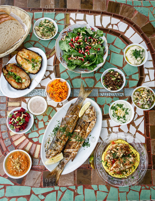Fried Fish And Side Dishes From Israeli Restaurant Stock Photo Offset