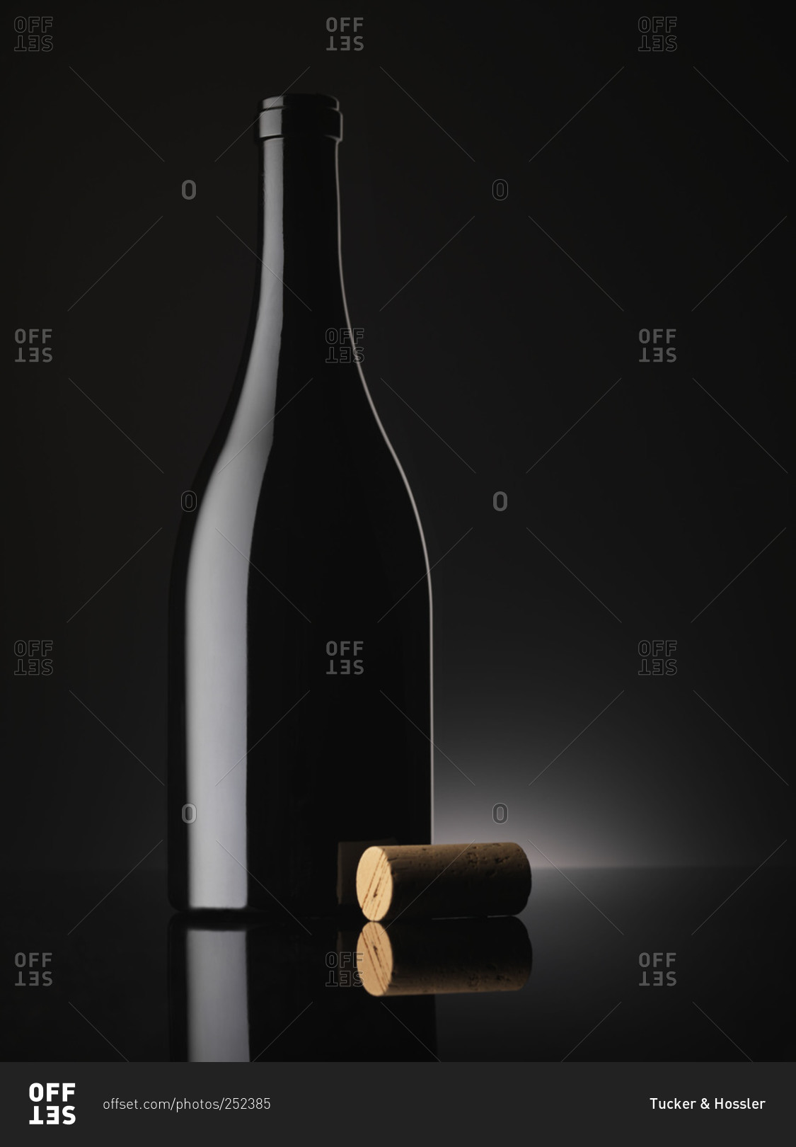 A black champagne bottle with a cork stock photo OFFSET