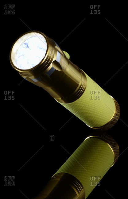 Illuminated flashlight pointing up