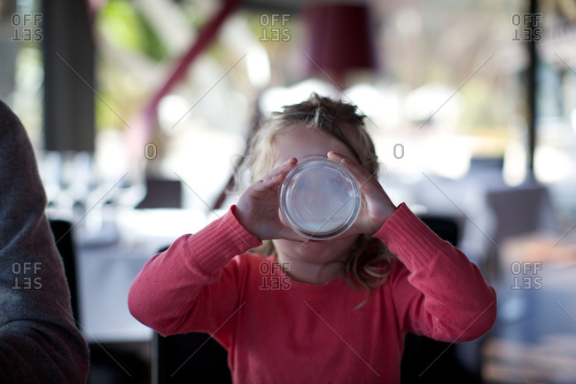 Girl drinking milk in restaurant