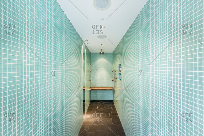 Modern tiled bathroom with multiple shower jets
