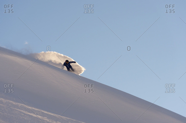 Snowboarding in powder snow in St. Moritz, Graubunden, Switzerland