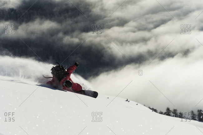 Snowboarding on powder snow in St. Moritz, Graubunden, Switzerland