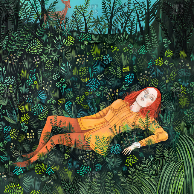 Redhead Girl Dressed In A Golden Armor And Lying On The Grass