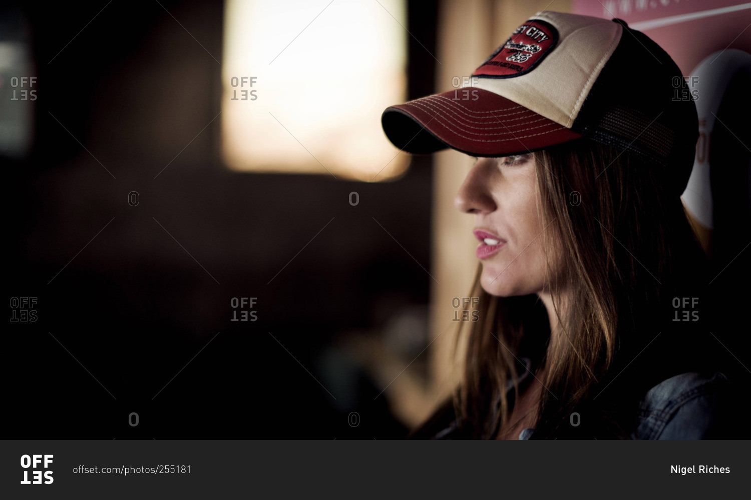 Young woman wearing a trucker cap
