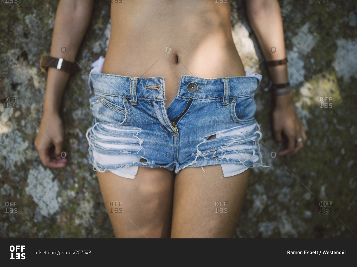 Sexy young woman wearing hot pants, close-up stock photo - OFFSET