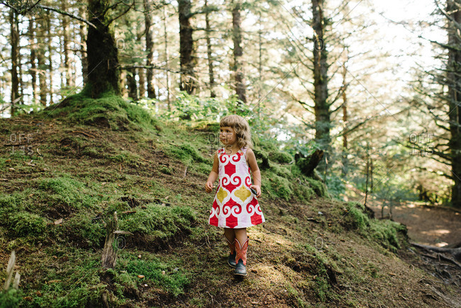 girl walking through forest