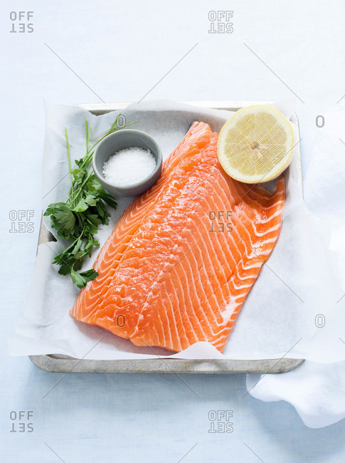 A filet of fresh salmon on metal tray
