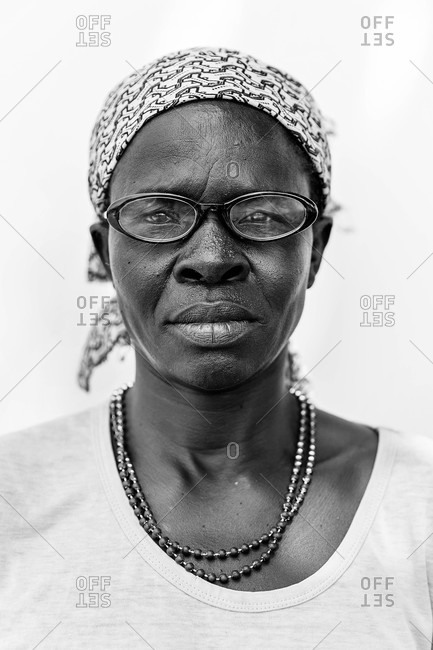 Paicho, Uganda - March 4, 2015: Portrait of a Ugandan woman wearing glasses