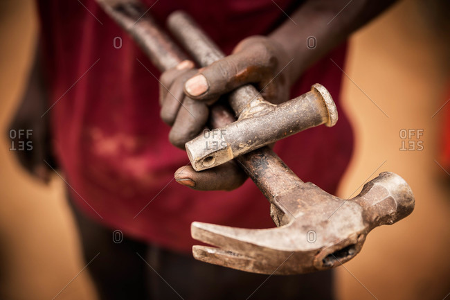 Man holding tools in his hand