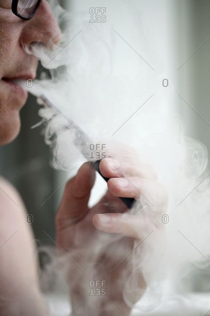 Man puffing on an e-cigarette